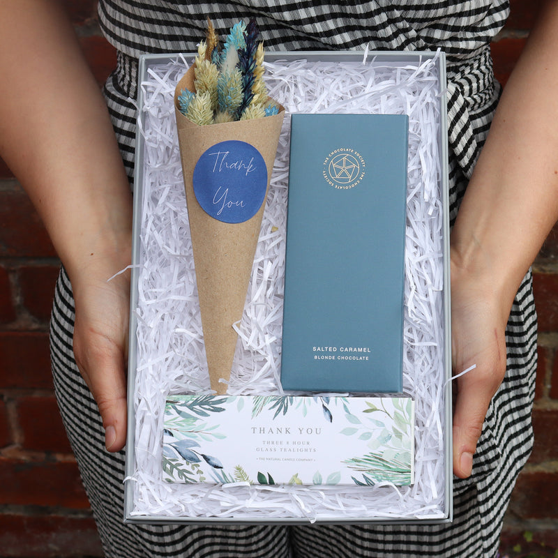 Thank you floral letterbox gift set containing chocolate bar, thank you tealights & blue and neutral tone dried flower posy