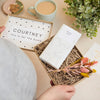Pregnancy kraft gift box containing bump bar chocolate bar, mini dried flower posy & personalised name and 'this is for the bump' message on inner box lid