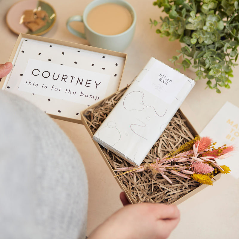 Pregnancy kraft gift box containing bump bar chocolate bar, mini dried flower posy & personalised name and 'this is for the bump' message on inner box lid