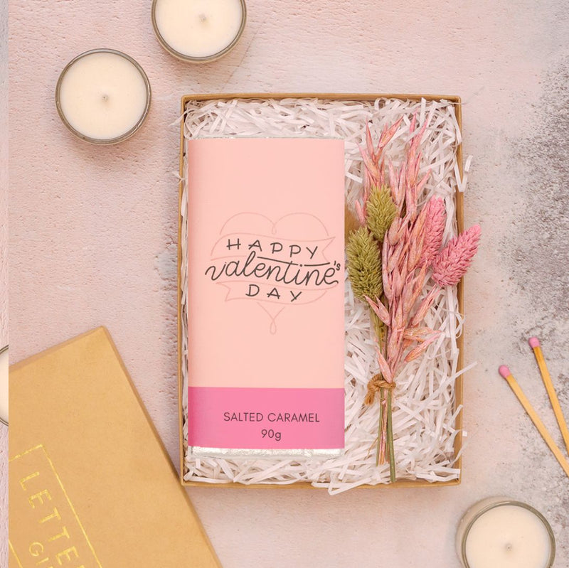 Mini Valentine's gift set containing 'happy valentine's day' salted caramel chocolate bar & pastel pink dried flower posy in a kraft box