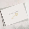 New home greetings card with gold key image