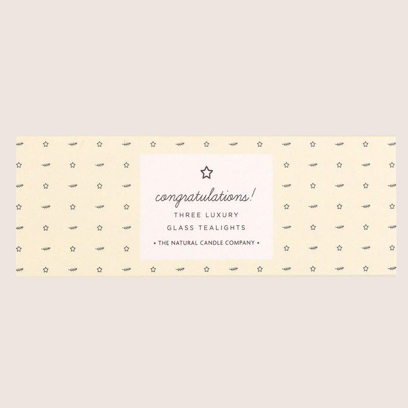 three 'congratulations' glass tealights in pale yellow sleeve