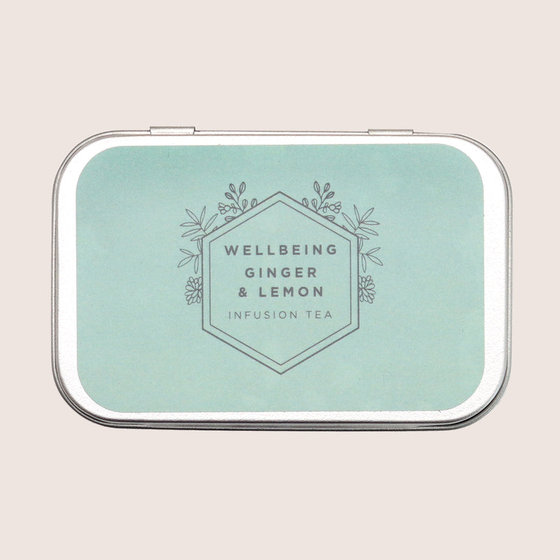 Wellbeing ginger & lemon tea pyramids in a tin with pale green label