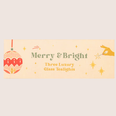 Three Christmas glass tealights with 'merry & bright' text and baubles & star images