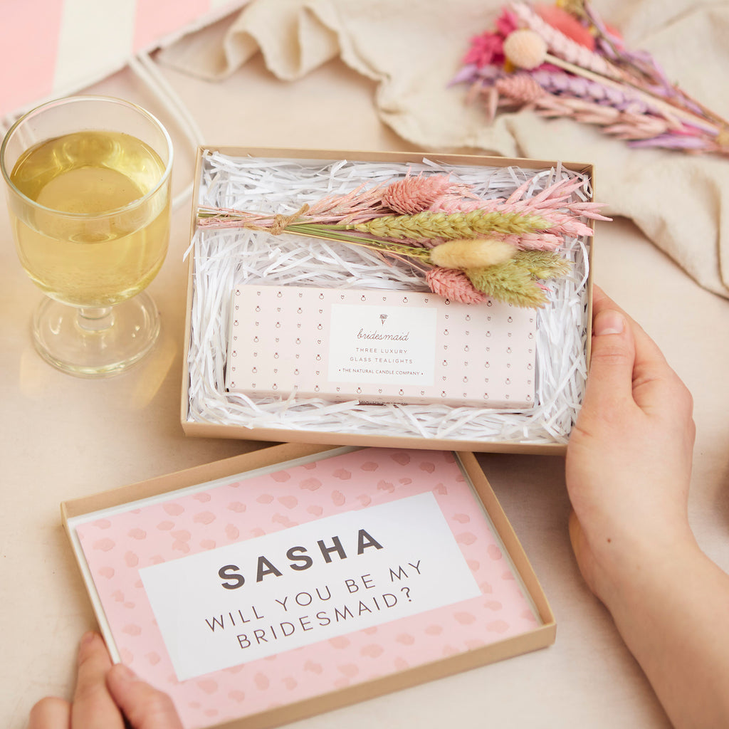 Mini letterbox gift set in kraft box, containing bridesmaid tealights & pastel pink dried flower posy with personalised box lid stating 'will you be my bridesmaid?'