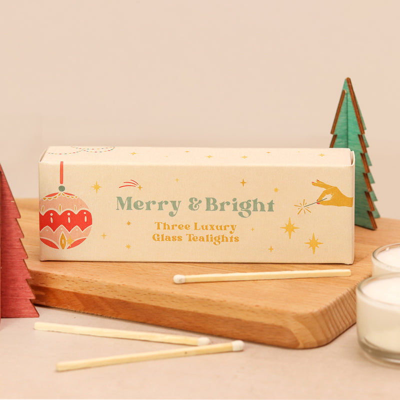Three Christmas glass tealights in a 'merry & bright' box with bauble & stars
